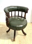 A Victorian mahogany captains swivel desk chair, the tub shaped crest rail above a turned spindle