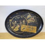 A Japanese lacquer oval tray with gilt decoration, measures 40cm x 31cm