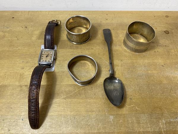 A group of three hallmarked silver napkin rings, a Georgian Scottish teaspoon, combined weight 61