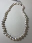 A strand of cultured pearls with cz set magnetic clasp fastening, measures 23cm