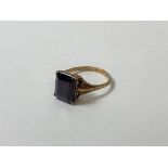 A single dark red stone ring, marked 9ct, size O