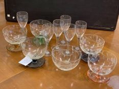 A set of five sorbet bowls, each with etched floral decoration on coloured glass stems and bases