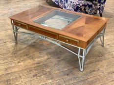 A late 20th century cherry coffee table, the top inset with bevelled glass panel, over four