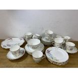 A set of twelve 1920's Hammersley teacups, measure 7cm high, eleven saucers, twelve side plates, a