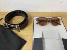 A pair of sunglasses by Finlay & Co, having wooden frames, measures 14cm across, a Dunhill black