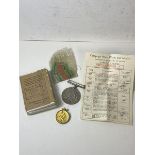 A Defence Medal, 1939-45, along with ribbon and original paperwork and box, and a gilt silver