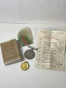 A Defence Medal, 1939-45, along with ribbon and original paperwork and box, and a gilt silver