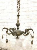 A quality early 20th century cast brass ceiling pendent light fitting, four leaf cast 'S' scroll