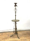 An Edwardian brass three branch standard light, with scrolled decoration, raised on triple splay