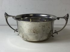 A 1935 Birmingham silver porringer, the twin handles with acorn finial's, initials to front and