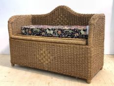 A Small basketwork hall bench, with associated floral upholstered squab cushion above a hinged seat,