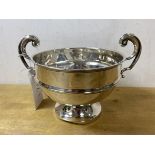 A 1920's / 30's Birmingham silver two handled footed flower bowl, measures 12cm high, weighs 164