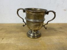 A 1935 Birmingham silver cigarette holder in the form of miniature trophy, measures 7.5cm high,