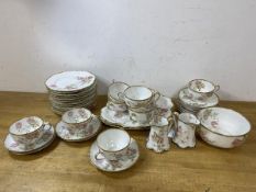 A Haviland Limoges 38 pc tea set including ten teacups, measure 5cm high, eleven saucers, twelve