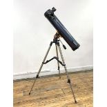 A Celestron AstroMaster LT76 telescope and stand, with 10mm and 20mm lens, L67cm