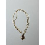 A thistle pendant necklace, chain and pendant both marked 9ct, pendant with amethyst, measures 26cm,
