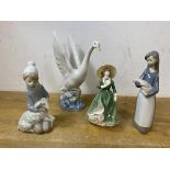 Two Lladro figures, one of girl holding piglet, measures 17cm high, a child holding a lamb, a Nao