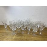 A quantity of stemware including wine glasses, sherry and port glasses and a single champagne