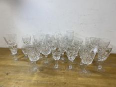 A quantity of stemware including wine glasses, sherry and port glasses and a single champagne