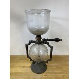 A vintage coffee peculator, the two glass reservoirs marked PS below a thistle, measures 46cm high