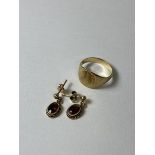 A pair of pendant earrings, marked 9ct, and a yellow metal signet style ring, size K/L