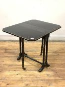 A Victorian ebonised Sutherland table, the top with drop leaves, canted corners and gilt detail on