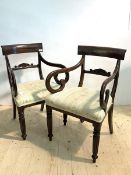 A Pair of Regency style mahogany elbow chairs, the shaped crest rail over scroll carved rail back,