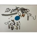 A mixed lot of costume and silver jewellery including necklaces, pendants, brooches, earrings etc (a
