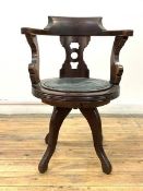 A 19th century mahogany captains swivel chair, the crest rail over pierced splat back, with a