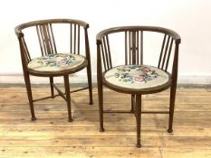 A pair of Edwardian mahogany bedroom chairs, the frame with string inlay, upholstered in