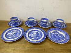 A set of four willow pattern teacups with saucers, and three side plates - measure 18cm diameter