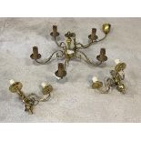 A brass four branch chandelier, with scrolled arms and faux candles, (H25cm, W59cm) together with