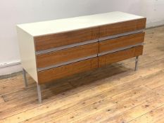 A mid century teak and white laminate chest, fitted with three drawers, one stamped Opus 22 raised