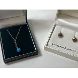A pendant necklace with blue polished stone in mount marked 9ct, on silver chain, and two stud