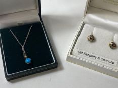 A pendant necklace with blue polished stone in mount marked 9ct, on silver chain, and two stud