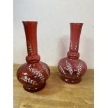 A near pair of late 19th early 20thc cranberry glass vases, each measures 25cm high