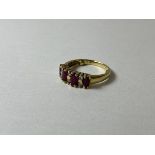 A ruby and diamond ring marked 18k, size K, weighs 3.45 grammes