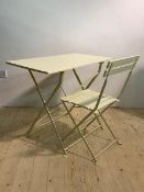 A Cream painted folding table, the rectangular wooden top raised on a folding metal base (H71cm,