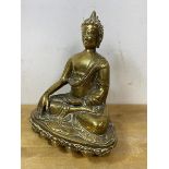 A South East Asian brass Buddha on lotus base stamped with crossed hand, measures 24cm high