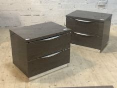 A pair of Italian high gloss bedside chests, each with two drawers, raised on an inset chrome