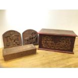 Two wooden carved Chinese panels, both depicting brickworks (21cm x 20cm), a Chinese box (hinge a/f)