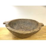 A large African hardwood bowl with two handles to sides, (18cm x 54cm x 46cm)