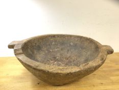 A large African hardwood bowl with two handles to sides, (18cm x 54cm x 46cm)
