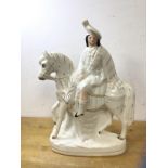 A Staffordshire flatback figure, gentleman riding horse with stag (38cm high)
