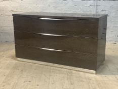 An Italian high gloss chest, fitted with three drawers, raised on an inset chrome pedestal foot,