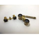 A pair of opera glasses with mother of pearl handle and eye pieces a/f, bridge marked with an I