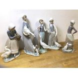 A group of four Lladro china figures, all with young women and ducks, (27cm h) and a Nao Spanish