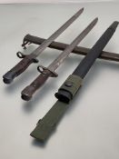 A 1907 Wilkinson pattern bayonet in leather scabbard and canvas frog together with a US Remington