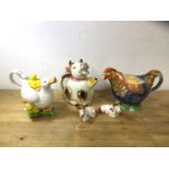 A group of three novelty china teapots including a Paul Cardew mother and ducklings doing fine, on