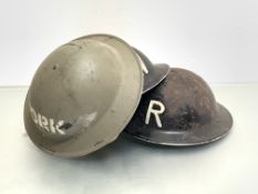 WWII British Steel helmets, two in black stencilled R & W and one green YORK with original liners (